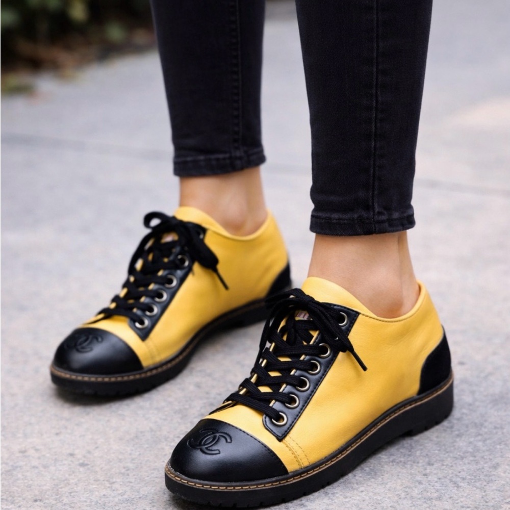 CHANEL women’s Black and Cream Sneakers